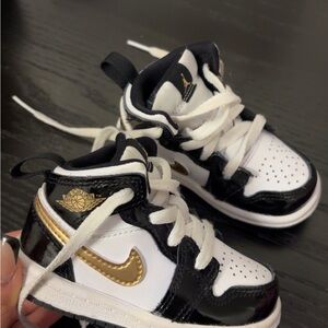 jordan 1s Kids Black and Gold Sneakers
